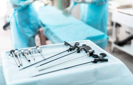 Laparoscopic surgical instruments on sterile desk in operating room
