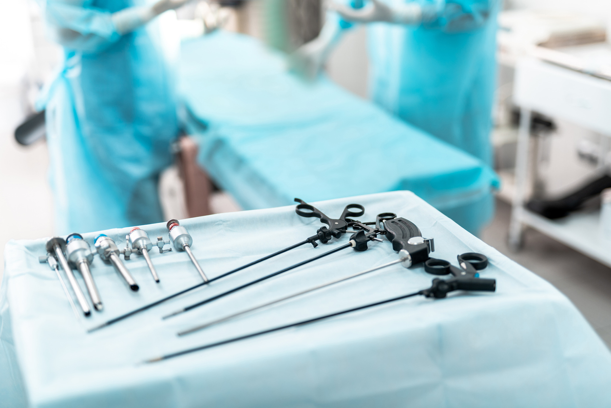 Laparoscopic surgical instruments on sterile desk in operating room